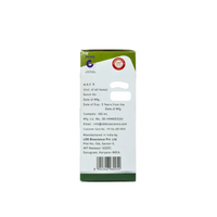 The back of a white medicine box with green top and bottom borders, featuring text details, a barcode, and a blue circular logo on a plain white background.