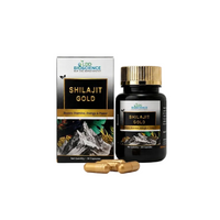 A bottle and box of LD Bioscience Shilajit Gold capsules, with three gold-colored capsules placed in front on a clean white background.
