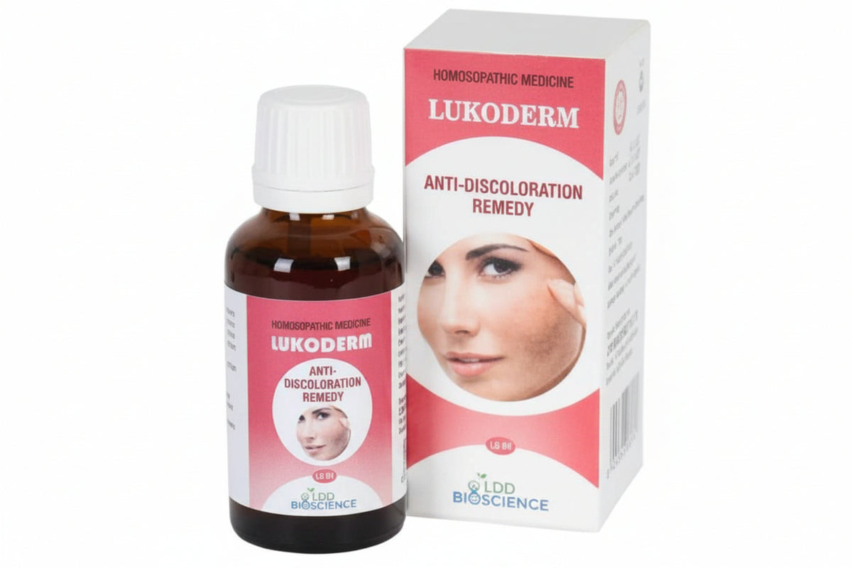 A bottle of Lukoderm Anti-Discoloration Remedy next to its retail box, featuring a white and pink design with a face illustration, on a white background.